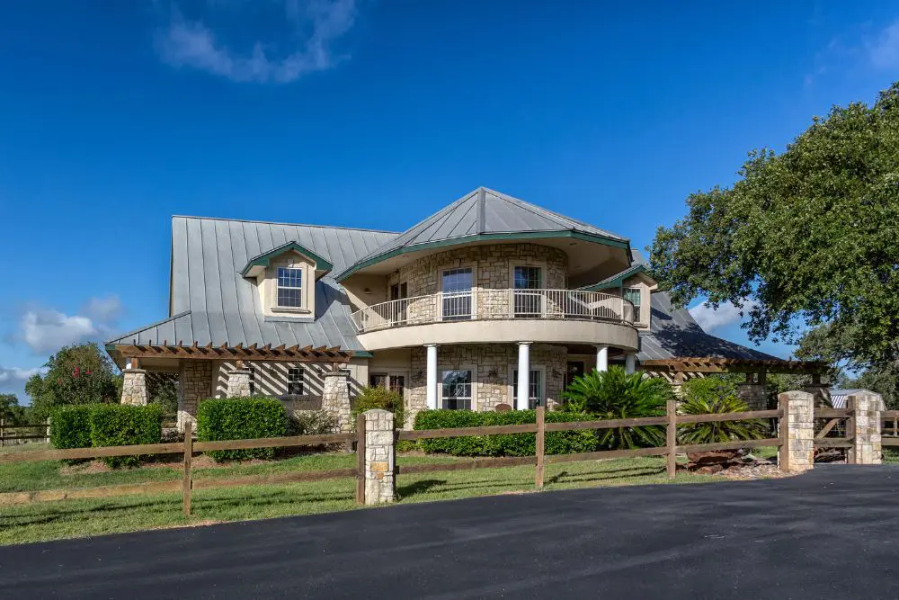 Luxury stone country home with metal roof